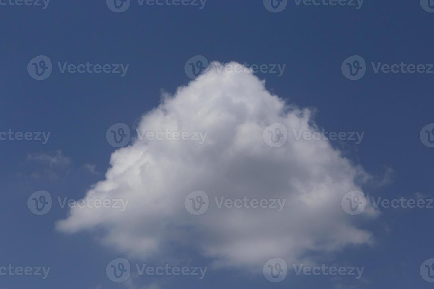 white cloud looking like pyramid in a blue sky photo