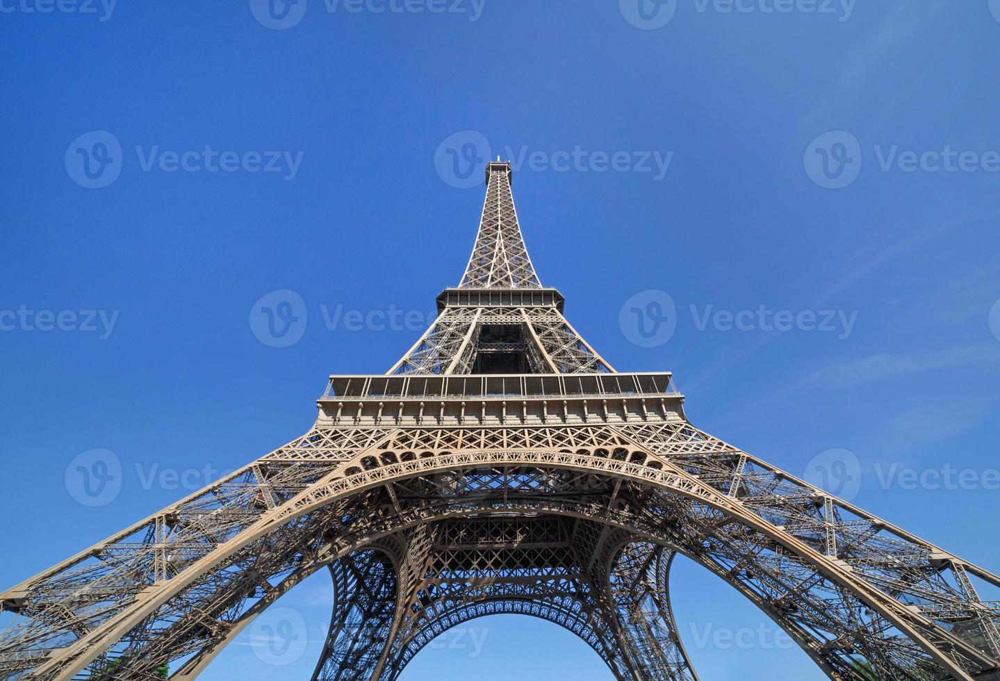 Eiffel tower in Paris against blue sky photo