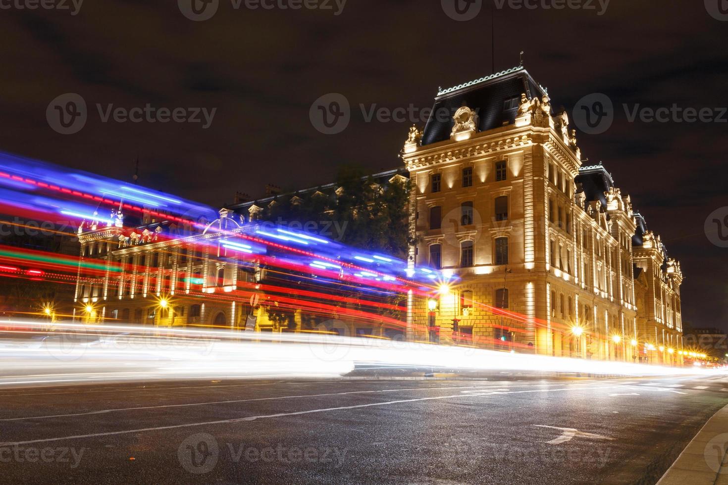 tracks of cars against Paris Police Prefecture building photo