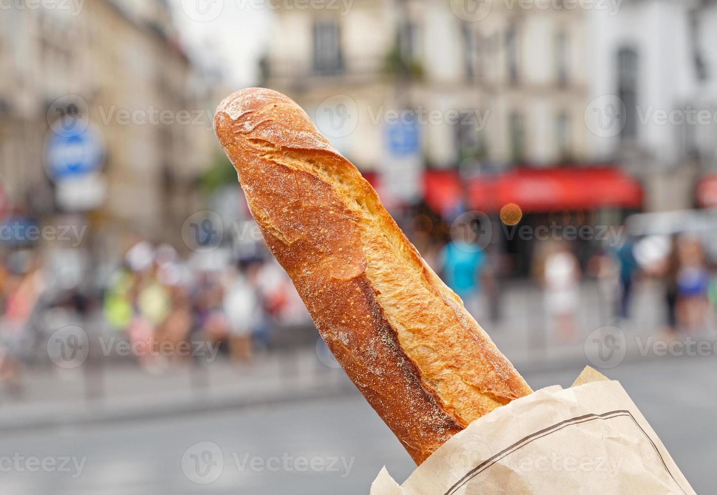 French baguette against street in Paris photo