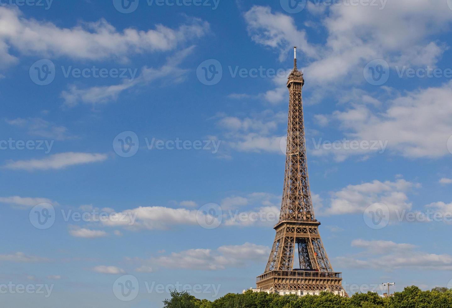Eiffel tower against blue sky with clouds photo