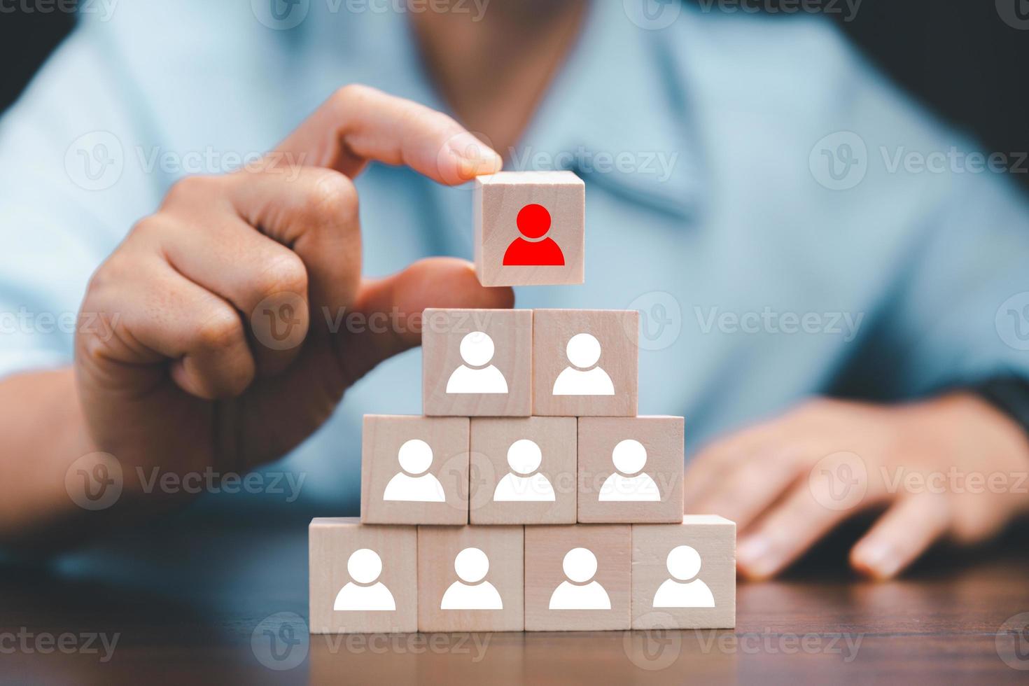 Manager chooses and hiring team for business success. HR manager hand or Employer chooses takes in hand employee. Leader stands out from crowd. Looking for good worker. HR, HRM, HRD concepts photo