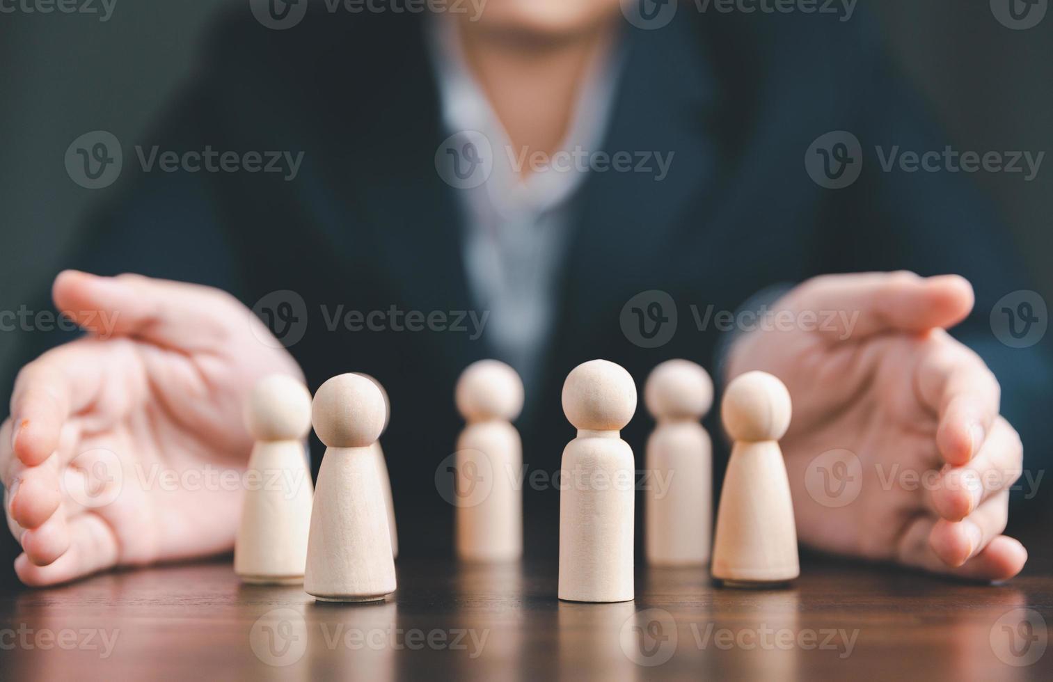 Manager chooses and hiring team for business success. HR manager hand or Employer chooses takes in hand employee. Leader stands out from crowd. Looking for good worker. HR, HRM, HRD concepts photo