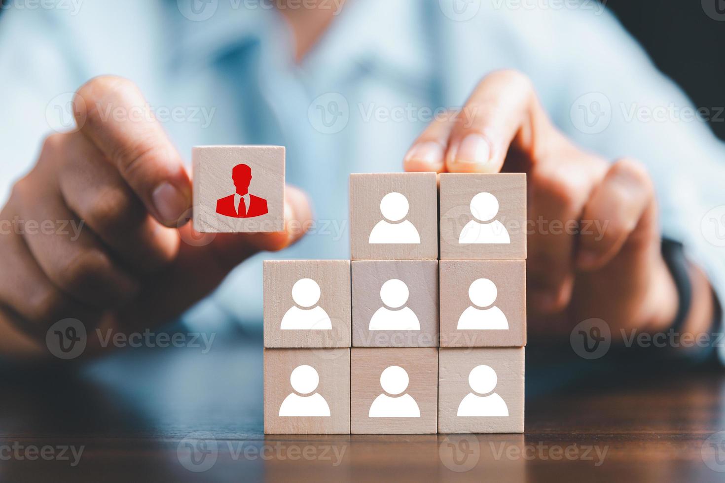 Manager chooses and hiring team for business success. HR manager hand or Employer chooses takes in hand employee. Leader stands out from crowd. Looking for good worker. HR, HRM, HRD concepts photo