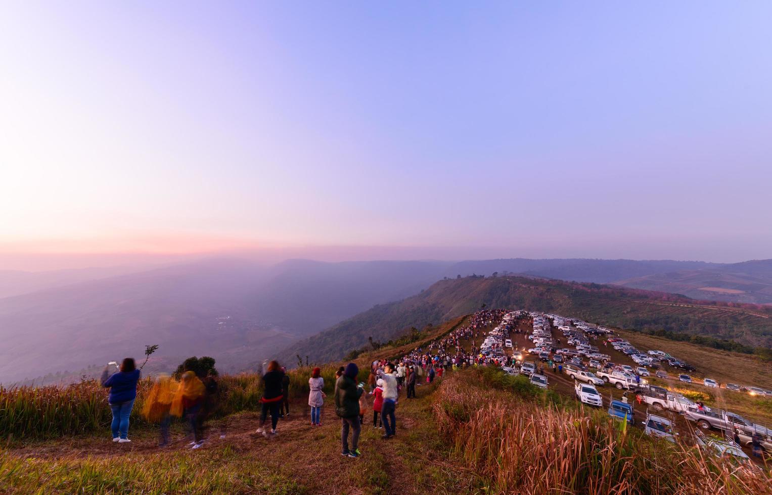 Tourists and many pickup truck come to see and photograph sunrise in the morning photo