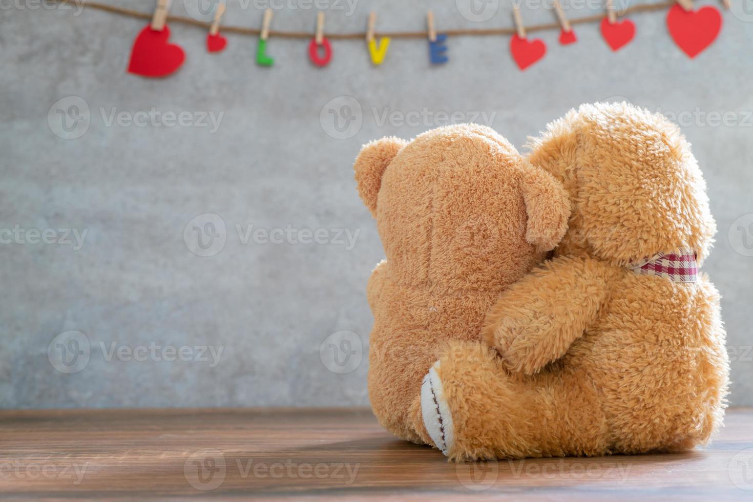 back side of two teddy Bear with Heart on marble background photo