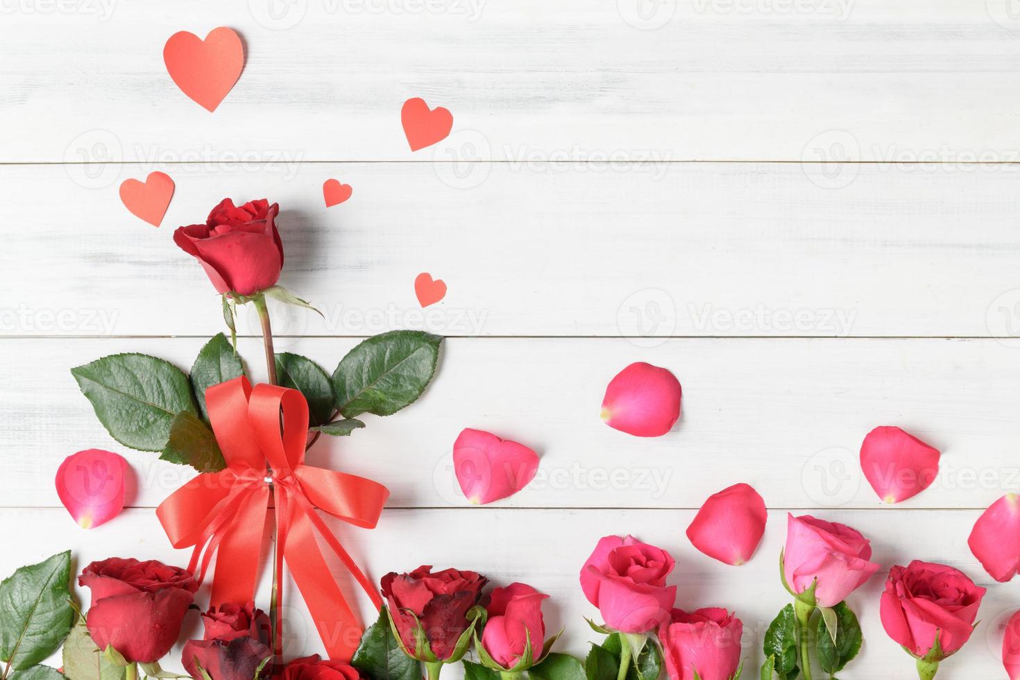 red and pink rose with paper heart photo