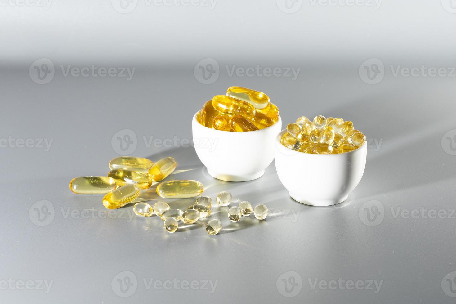 Vitamin D, omega 3, omega 6, Food supplement oil filled fish oil, vitamin A, vitamin E, flaxseed oil. photo