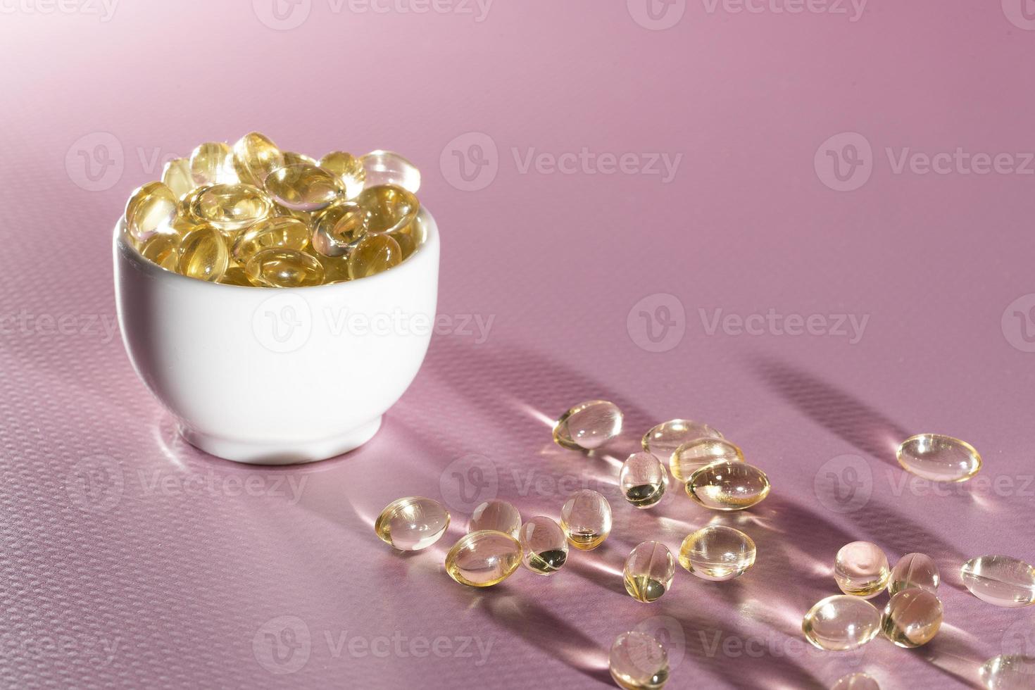 Vitamin D, omega 3, omega 6, Food supplement oil filled fish oil, vitamin A, vitamin E, flaxseed oil. photo