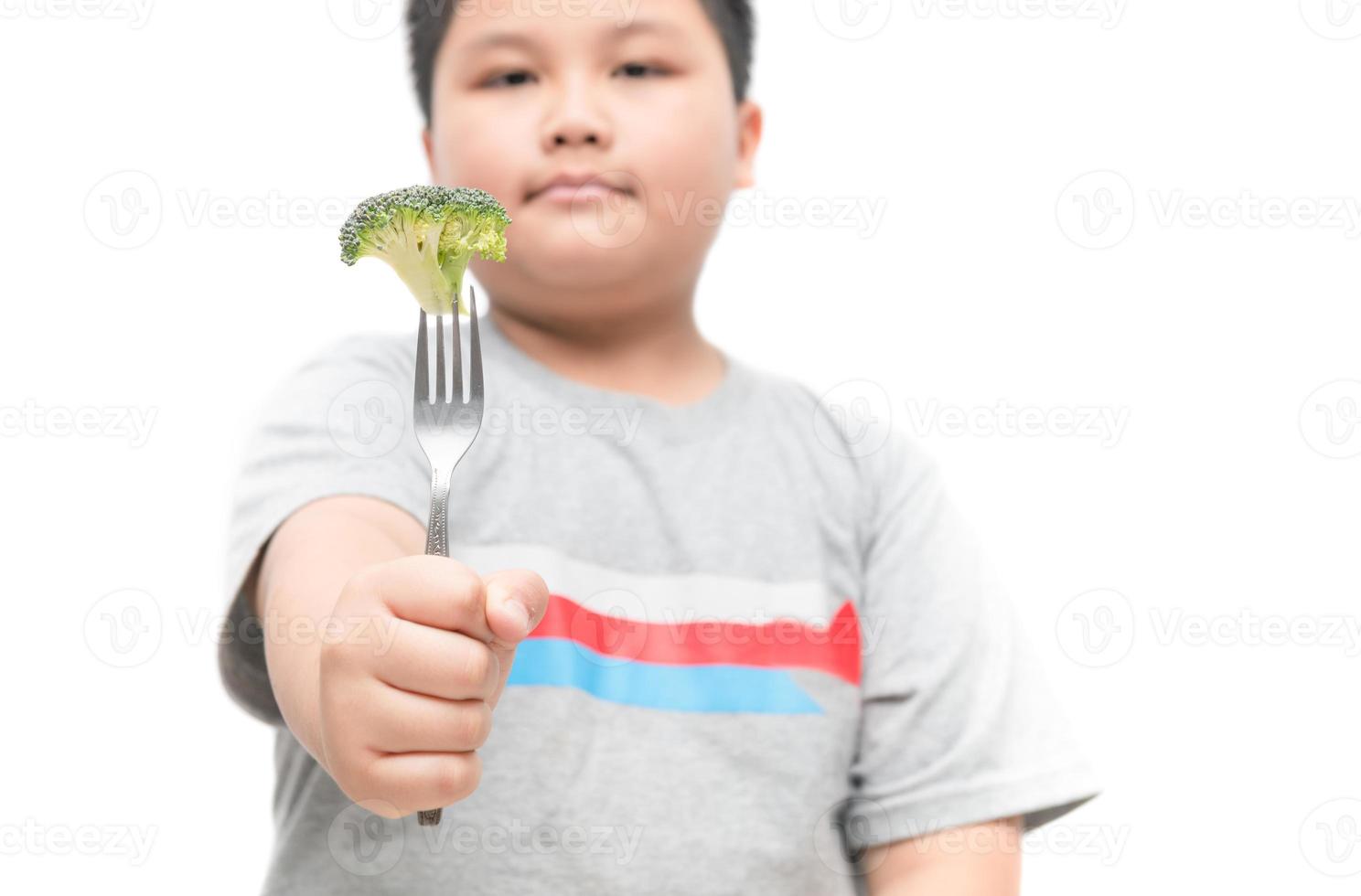 broccoli on hand obese fat boy isolated photo