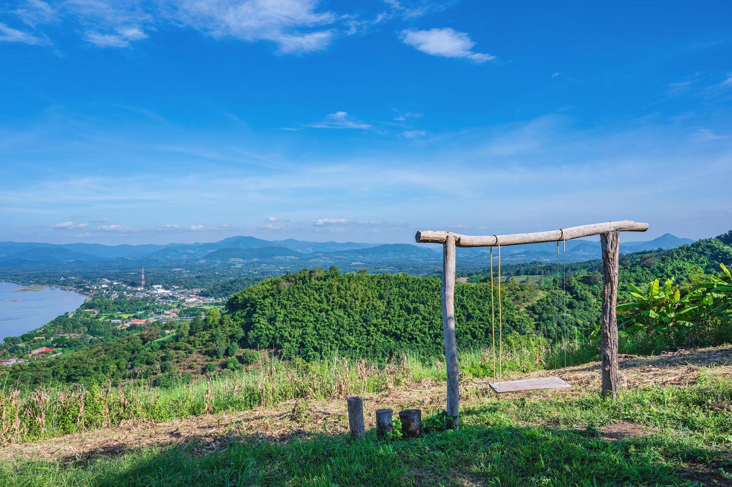 Beautiful landscape view and wooden swing on Phu Lamduan at loei thailand.Phu Lamduan is a new tourist attraction and viewpoint of mekong river between thailand and loas. photo