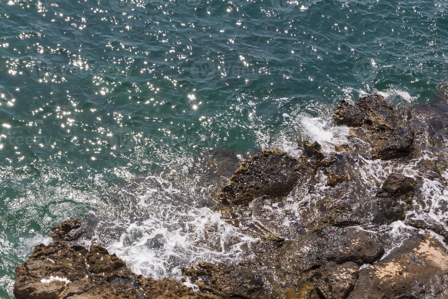 view on sunshine in aqua waves of sea in Antalya photo