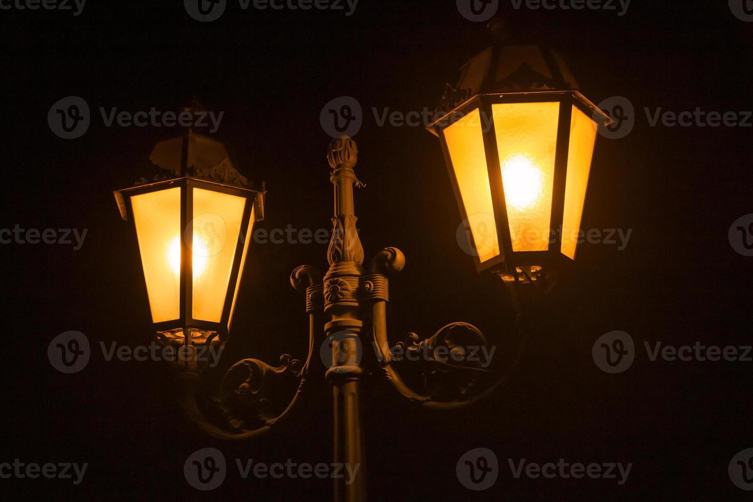 close up of street lamp at night photo