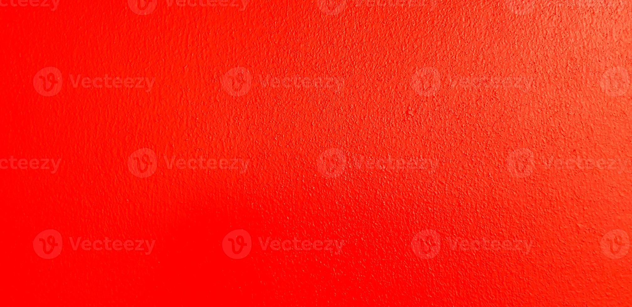 Red concrete wall for background. Colorful or pastel painted brickwork wallpaper. Exterior design in loft style concept. photo