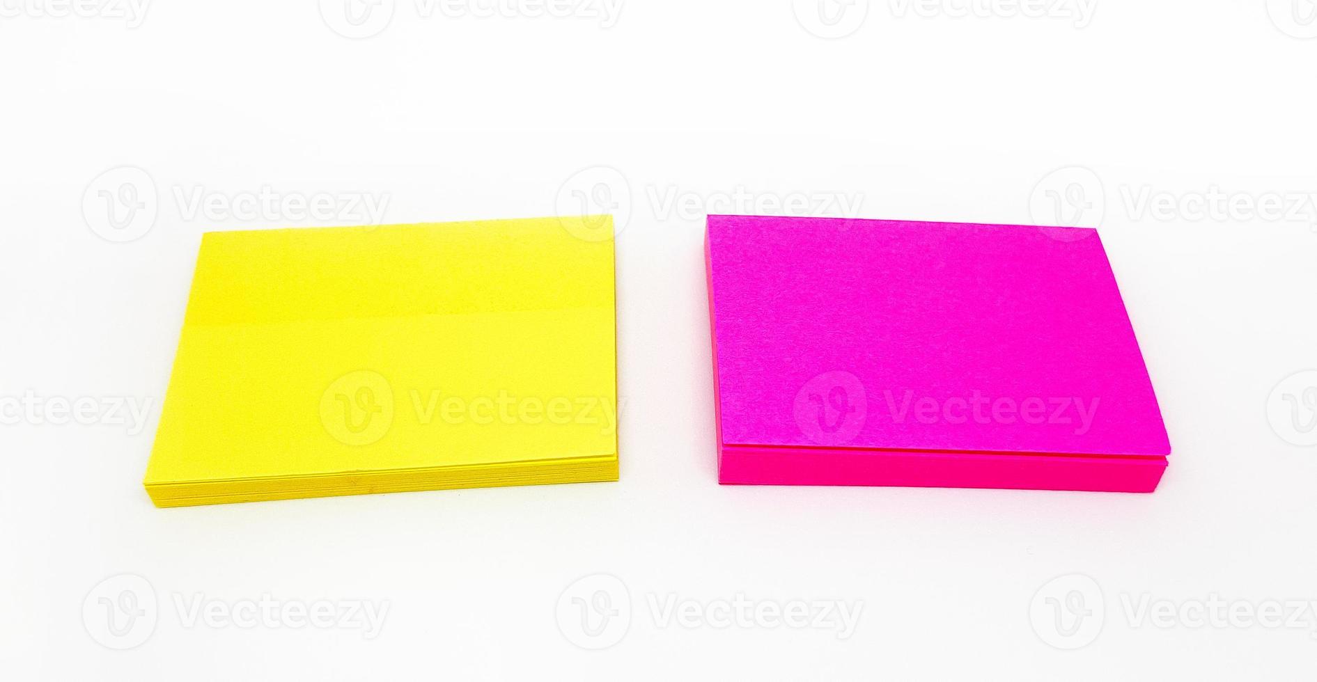 Colorful or multicolor post it isolated on white background. Yellow and pink paper for writing message, idea, notice, memo or information. photo