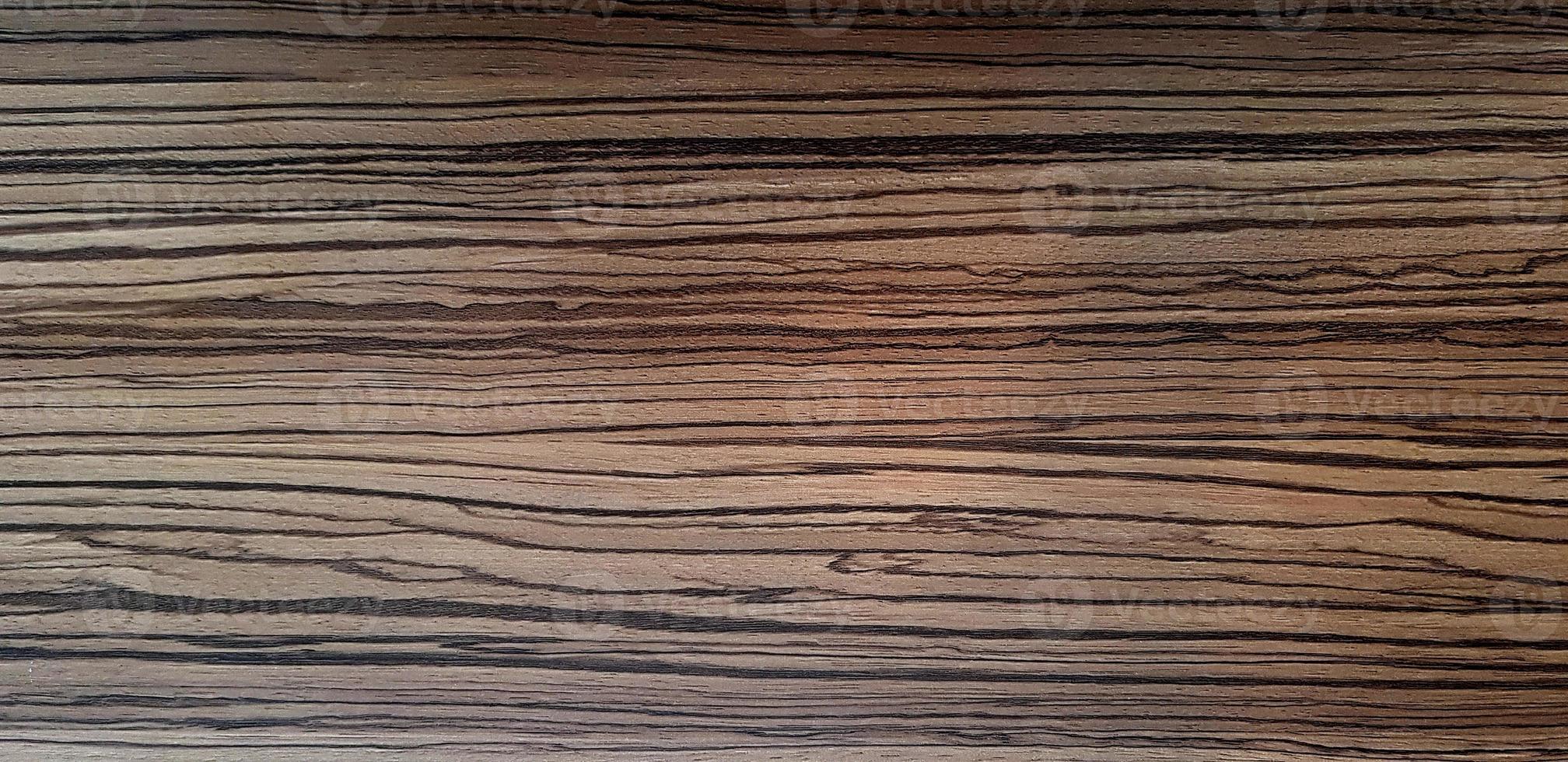 Pattern of dark brown wooden table or floor for background. Wood material, Abstract Wallpaper and Surface concept. photo