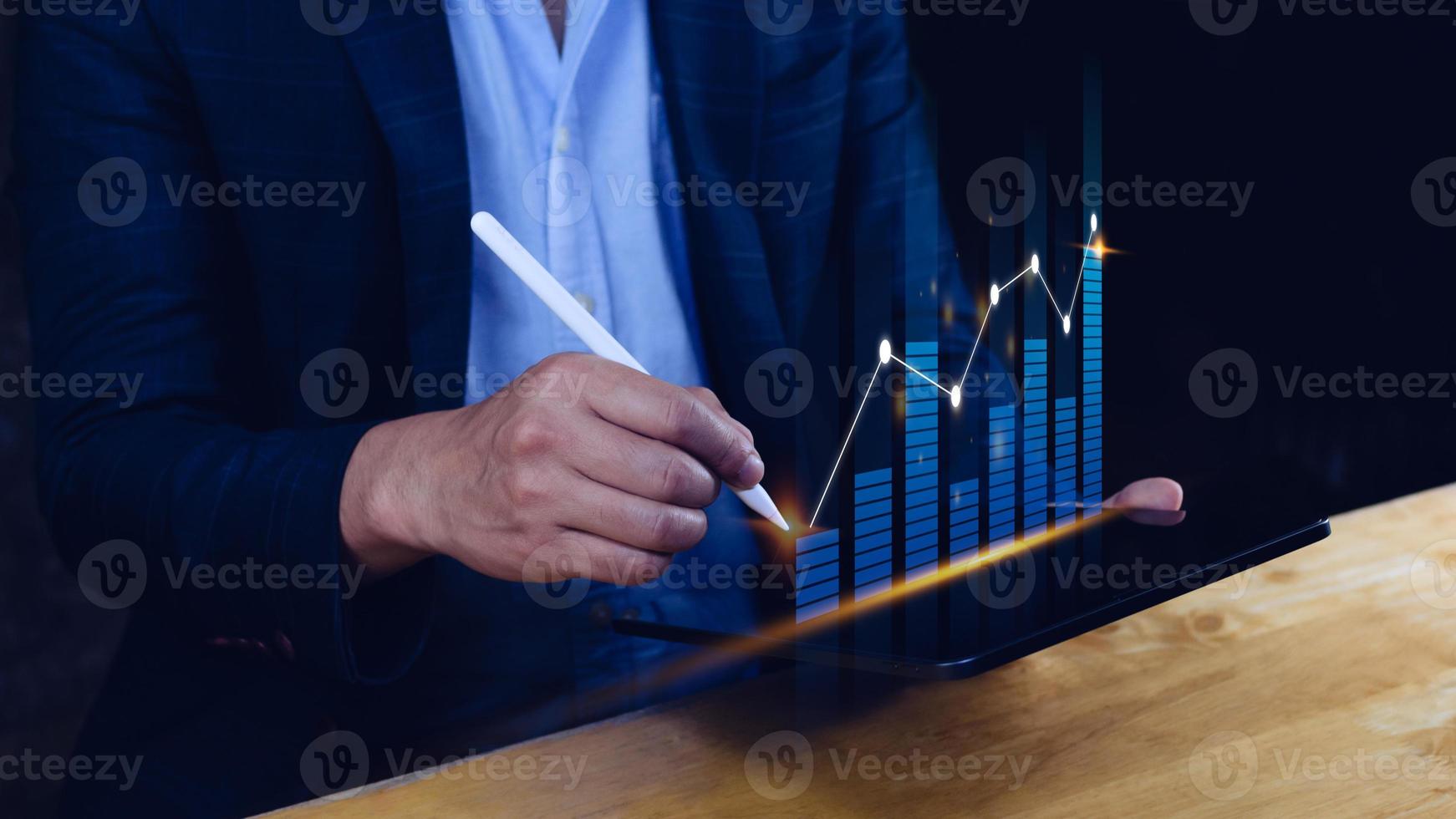 Businessman stylus pen touch points symbol stock graph and chart background, concept growth and development business investment, Stock market and strategy making market plan photo