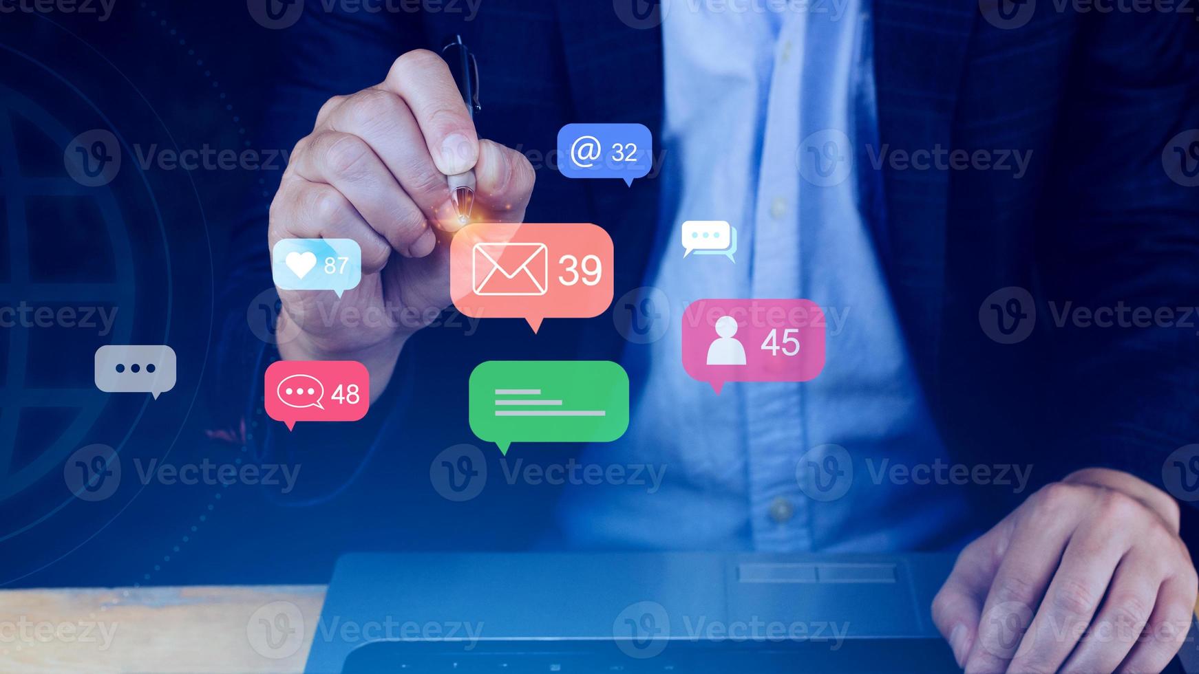 People using social media and digital online marketing concepts on laptop with icons such as notifications, messages, comments on the smartphone screen. photo