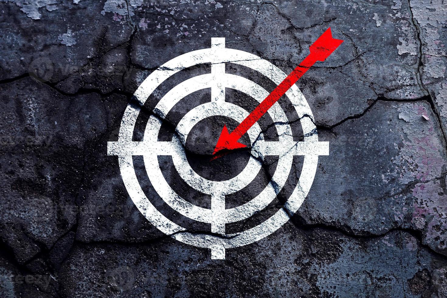 Target figure on broken wall, concept of achieving goal quality, Aim Target Red Symbols of goals and objectives over grunge background. business idea photo