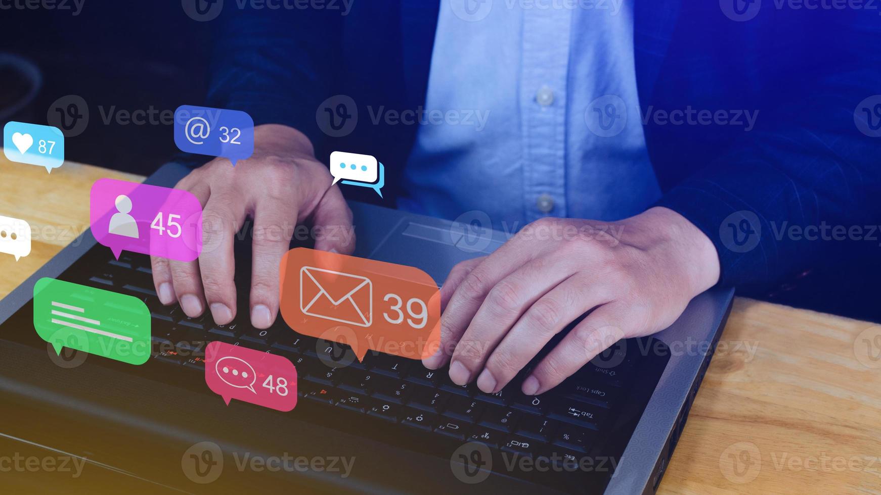 People using social media and digital online marketing concepts on laptop with icons such as notifications, messages, comments on the smartphone screen. photo