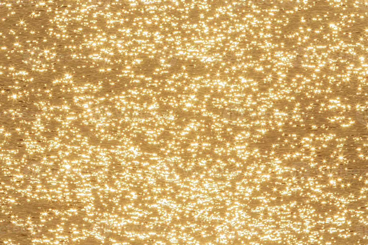 golden abstract sunshine on water background photo