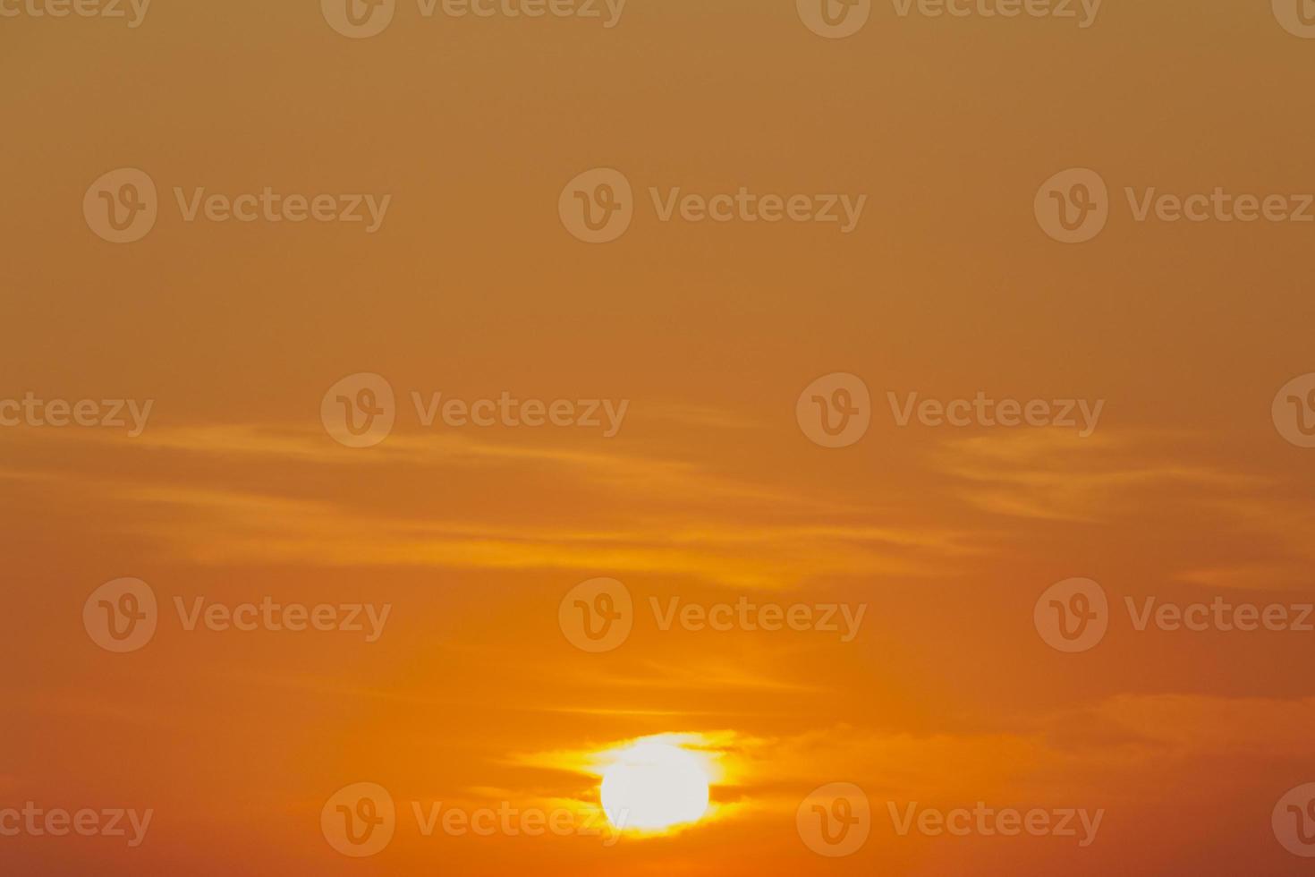 orange sky with sun at sunset photo