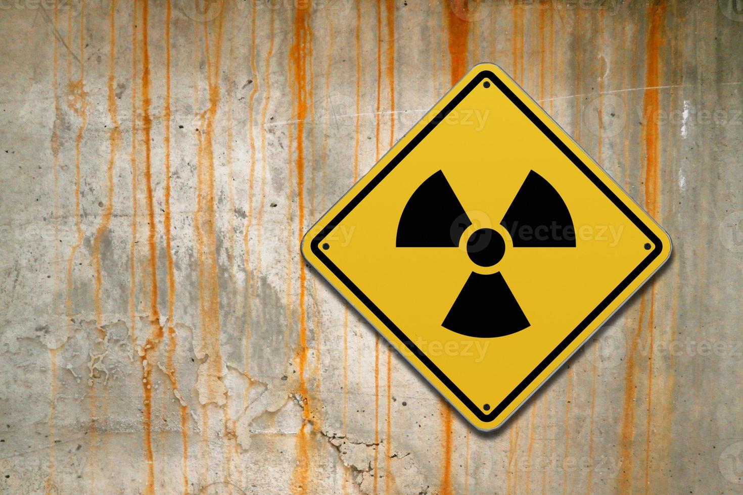 Radioactive warning sign on a wall photo