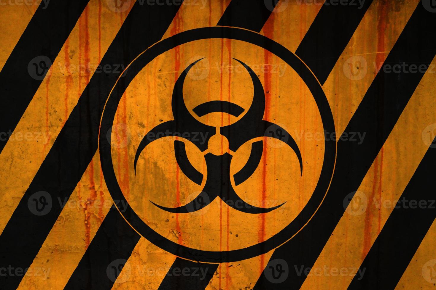 Biohazard symbol on a striped painted concrete wall photo