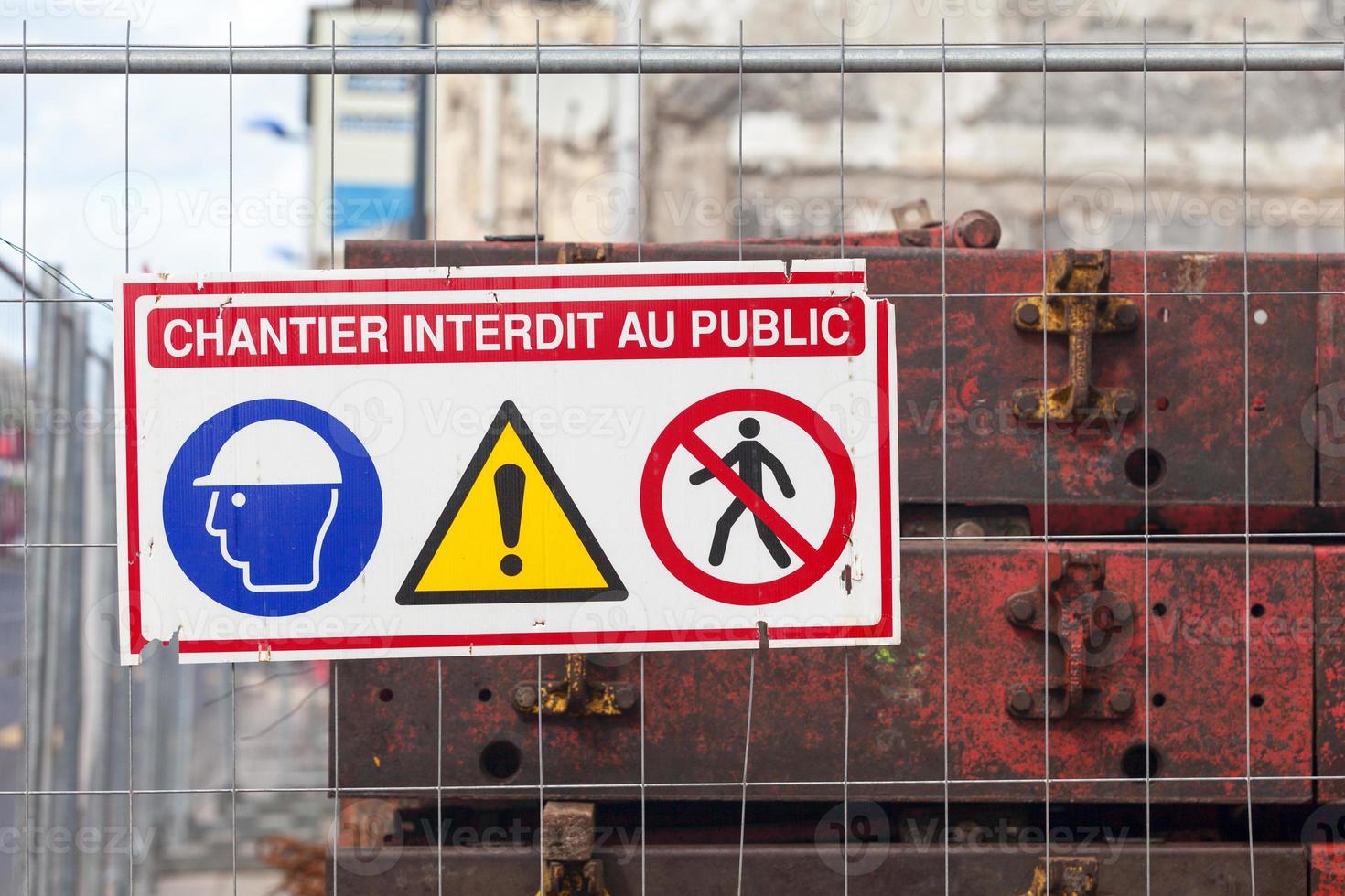 French sign on a fence stating Do not enter construction site photo