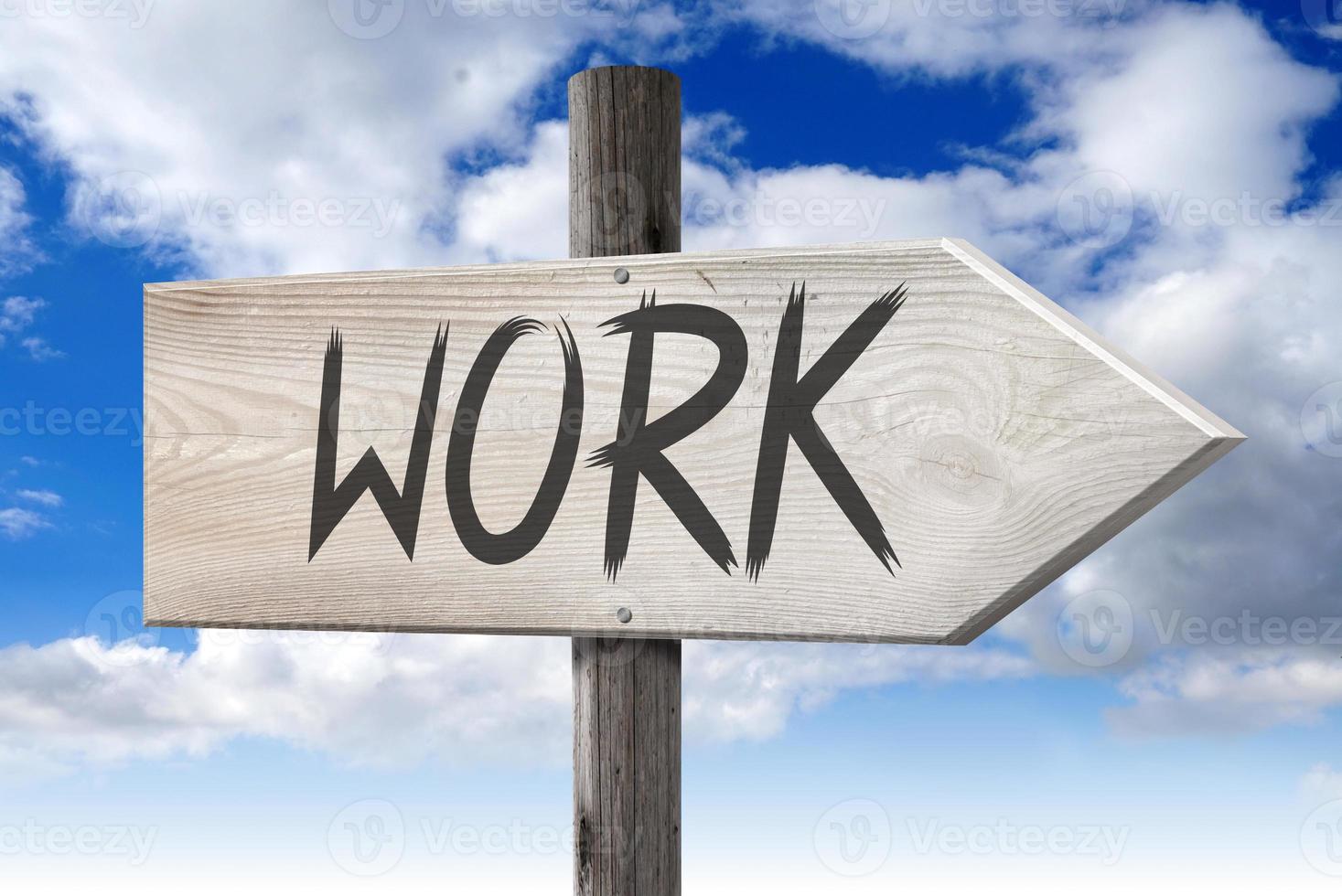 Work - Wooden Signpost with one Arrow and Cloudy Sky in Background photo