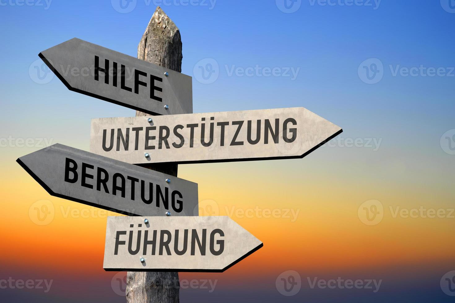 Help, Support, Advice, Guidance in German - Wooden Signpost photo