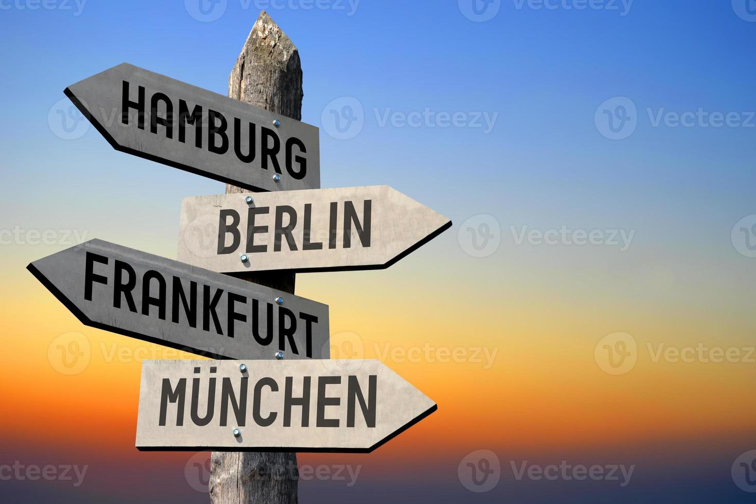 Hamburg, Berlin, Frankfurt, Munich - Wooden Signpost photo