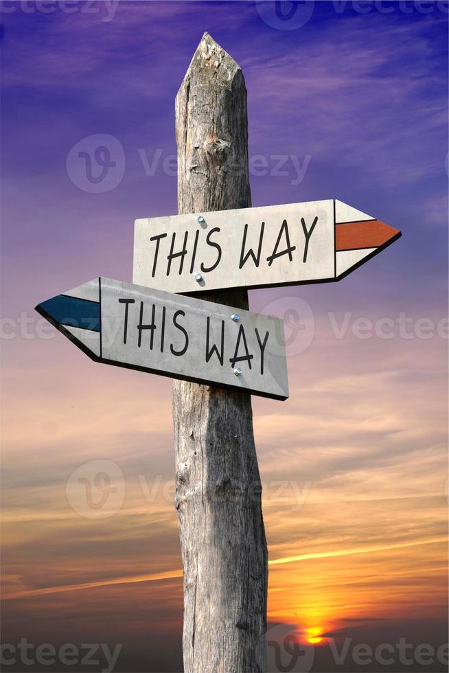 This Way - Signpost with Two Arrows, Sunset Sky in Background photo