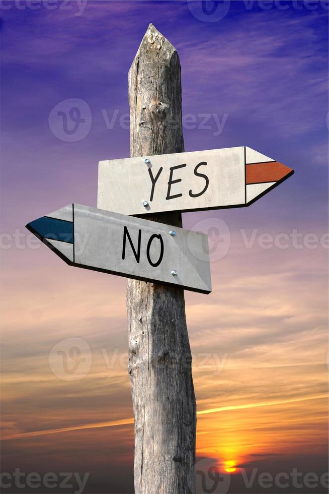 Yes or No - Signpost with Two Arrows, Sunset Sky in Background photo