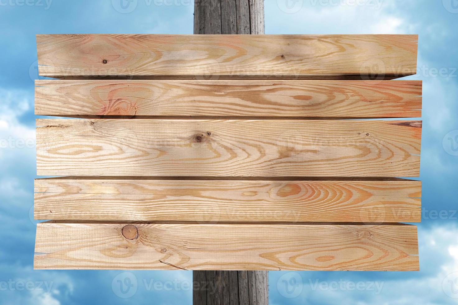 Wooden Board on Post with Sky in Background photo