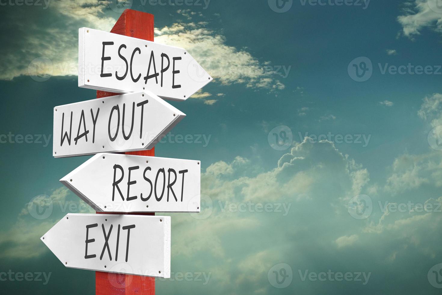 Escape, Way out, Resort, Exit - Wooden Signpost with Four Arrows photo