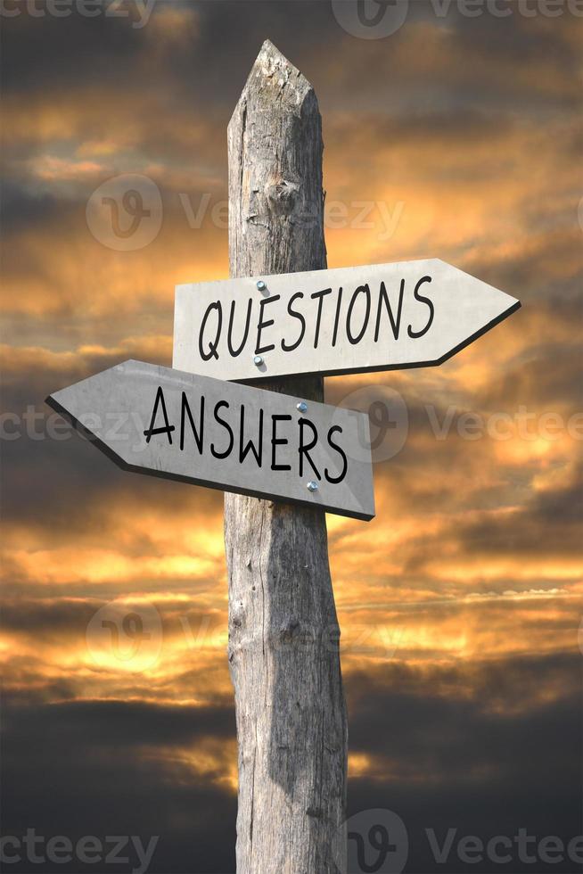 Questions and Answers - Wooden Signpost with Two Arrows and Sunset Sky photo