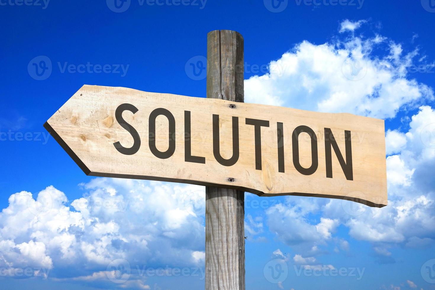 Solution - Wooden Signpost with one Arrow, Sky with Clouds in Background photo