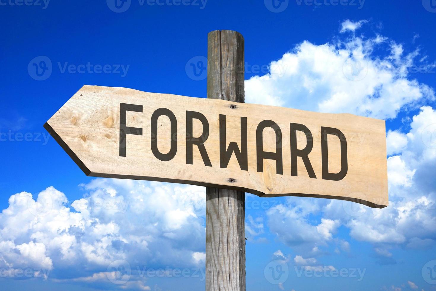 Forward - Wooden Signpost with one Arrow, Sky with Clouds in Background photo