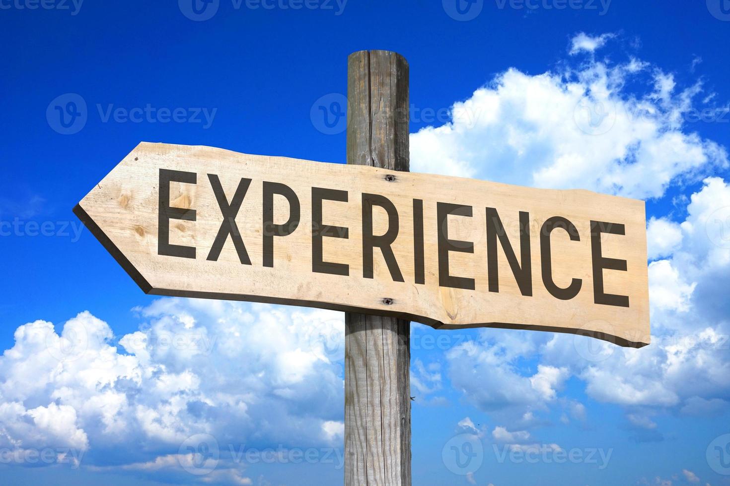 Experience - Wooden Signpost with one Arrow, Sky with Clouds in Background photo