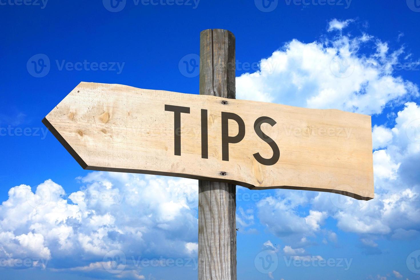 Tips - Wooden Signpost with one Arrow, Sky with Clouds in Background photo