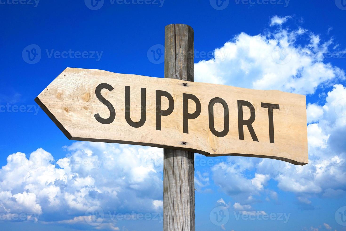 Support - Wooden Signpost with one Arrow, Sky with Clouds in Background photo