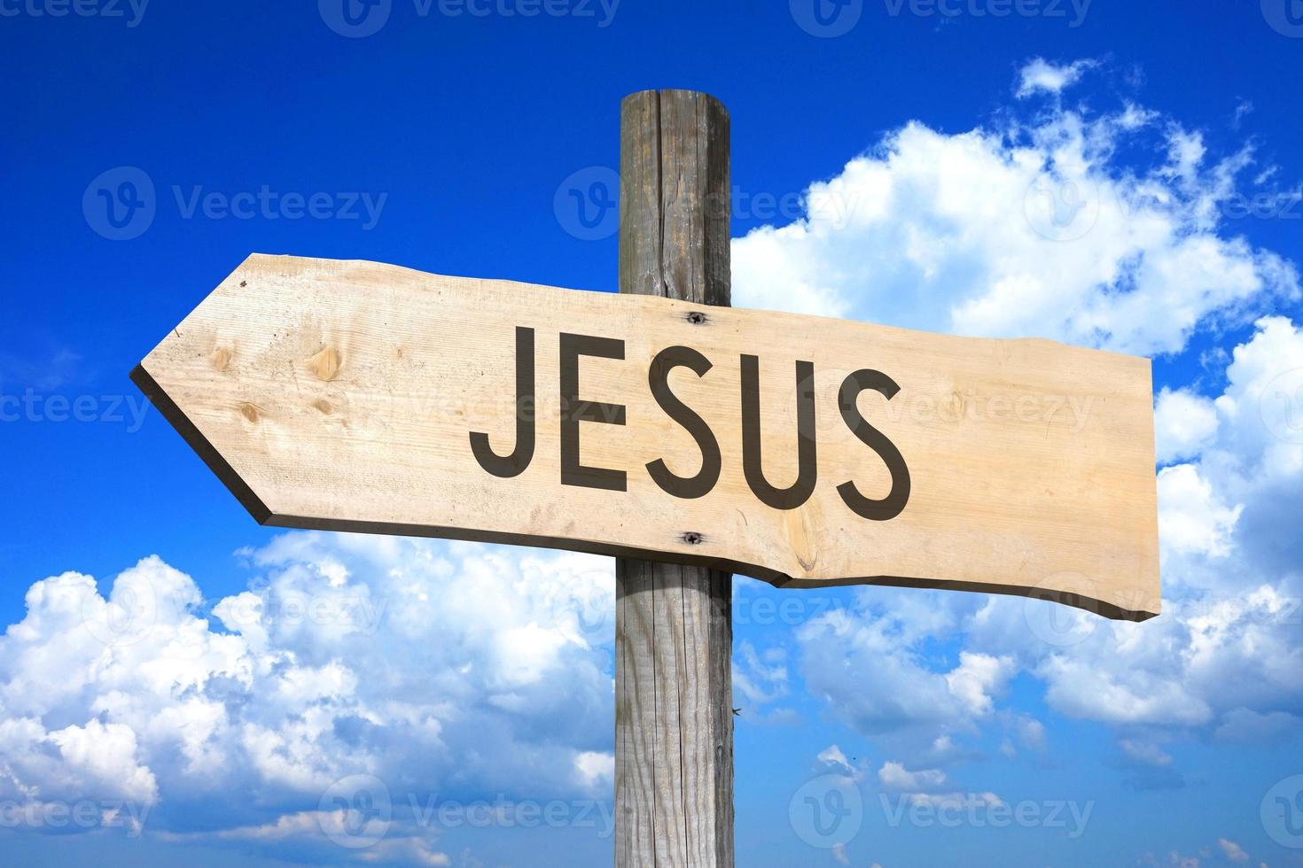 Jesus - Wooden Signpost with one Arrow, Sky with Clouds in Background photo