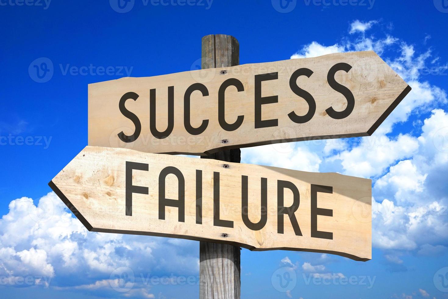 Success, Failure - Wooden Signpost with Two Arrows, Sky with Clouds in Background photo