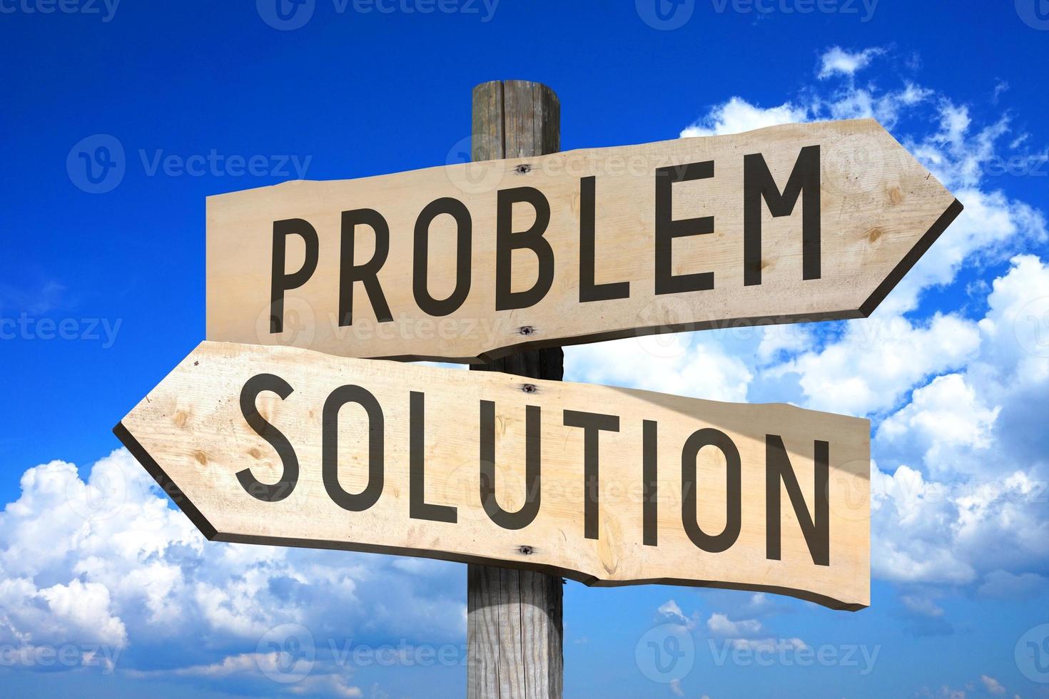 Problem, Solution - Wooden Signpost with Two Arrows, Sky with Clouds in Background photo