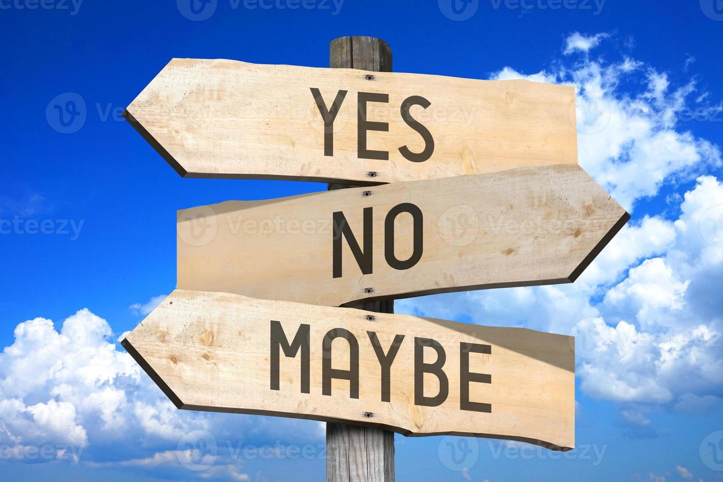 Yes, No, Maybe - Choice Concept - Wooden Signpost with Three Arrows photo