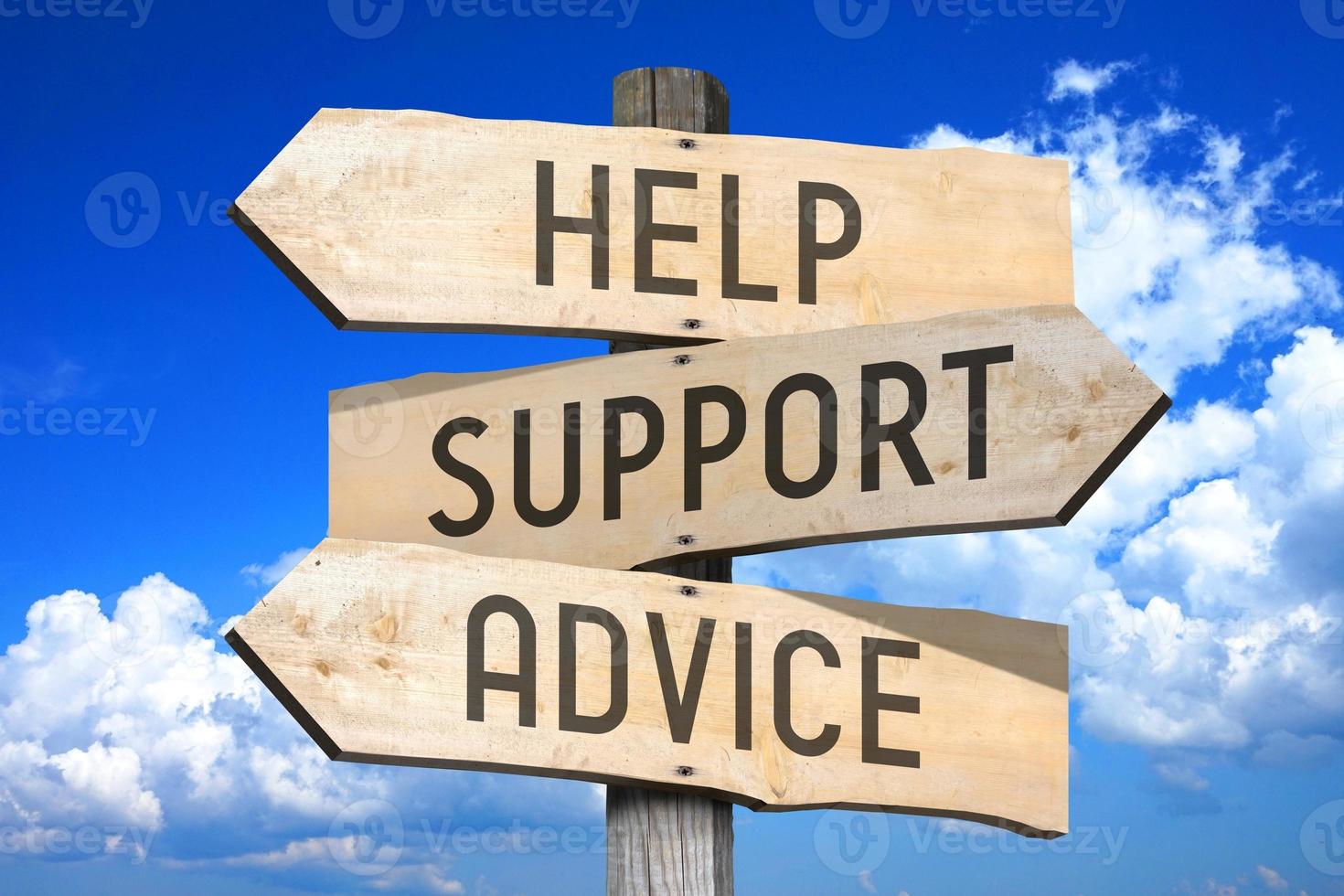 Help, Support, Advice - Wooden Signpost with Three Arrows, Sky with Clouds in Background photo