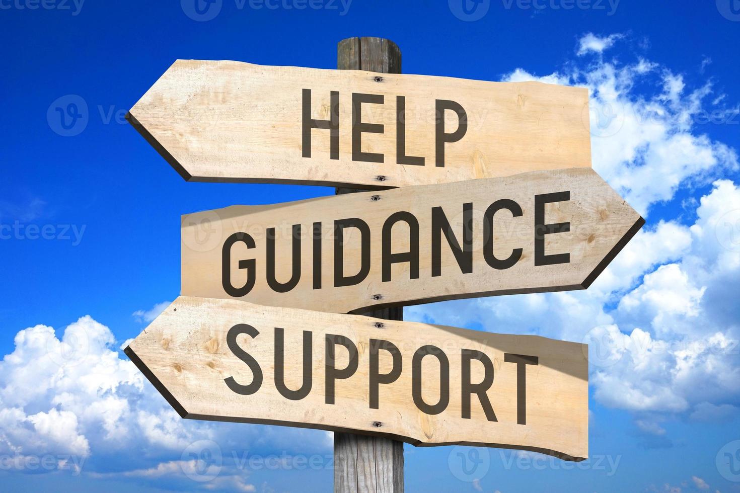 Help, Guidance, Support - Wooden Signpost with Three Arrows, Sky with Clouds in Background photo