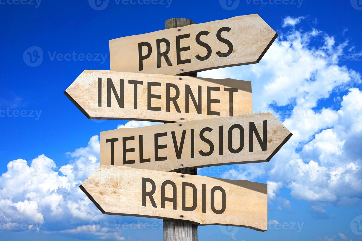 Press, Internet, Television, Radio - Media Concept - Wooden Signpost with Four Arrows photo