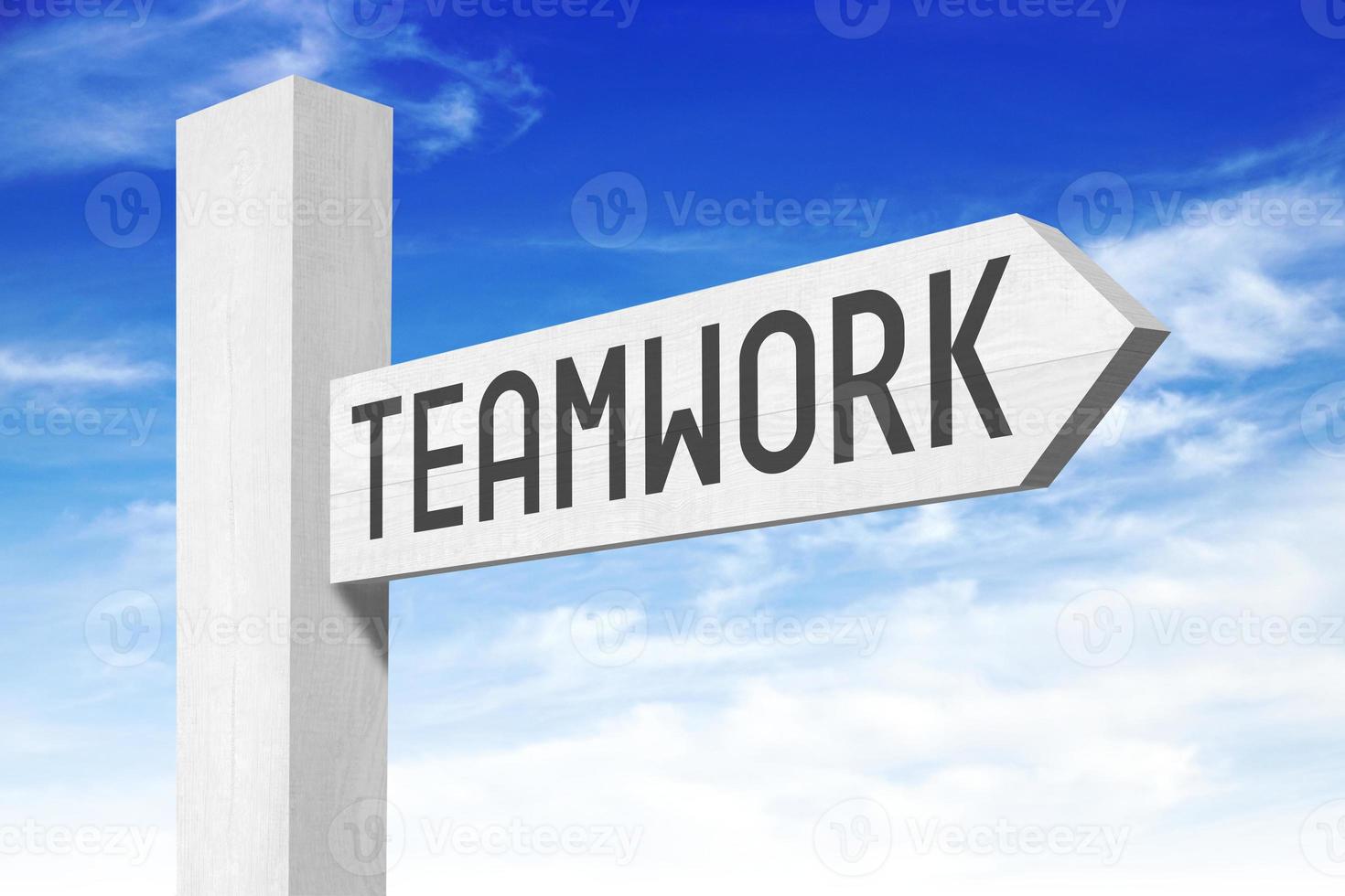 Teamwork - White Wooden Signpost with one Arrow photo